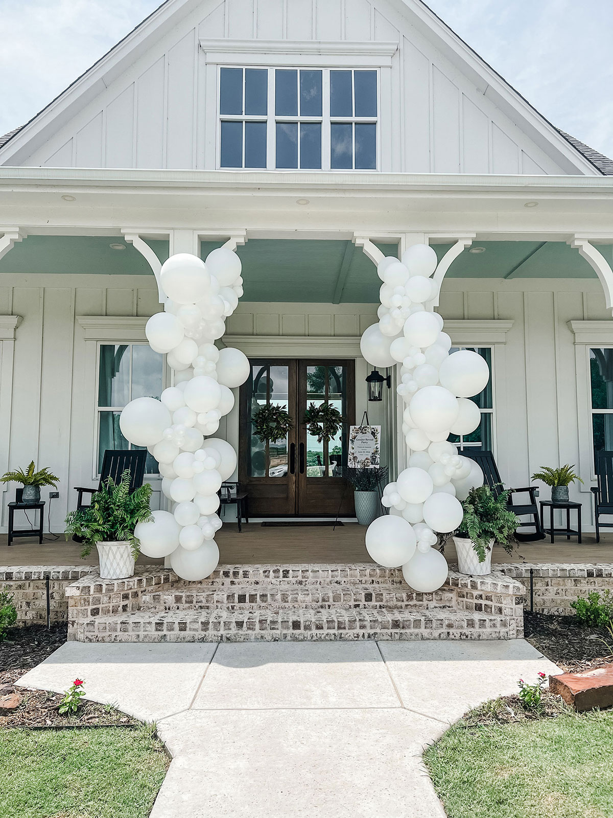 White Columns — classic white column balloon installation for an event
