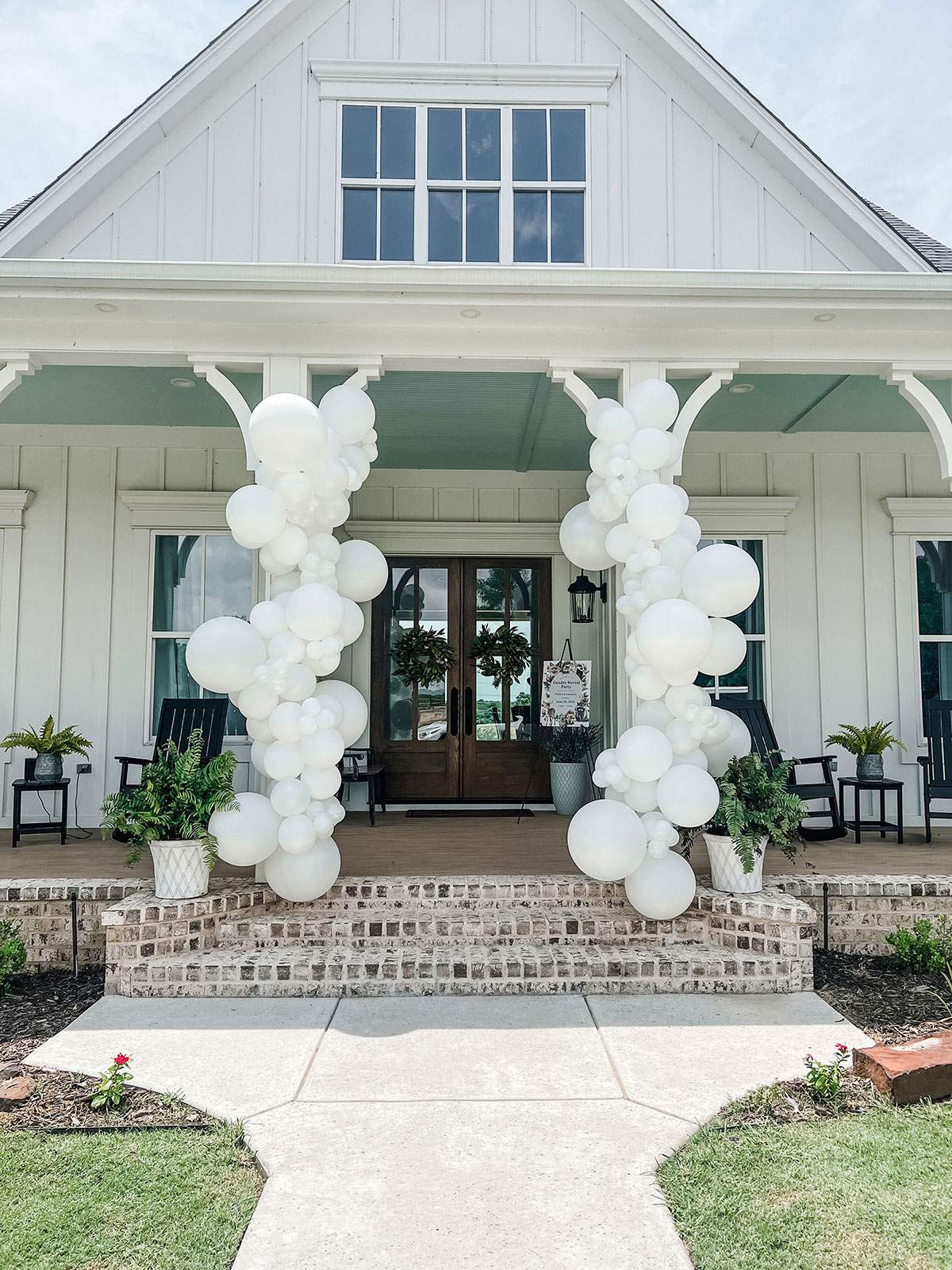White Columns — classic white column balloon installation for an event